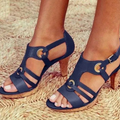 Women's heeled sandals featuring cut-out design and ventilated upper. 6