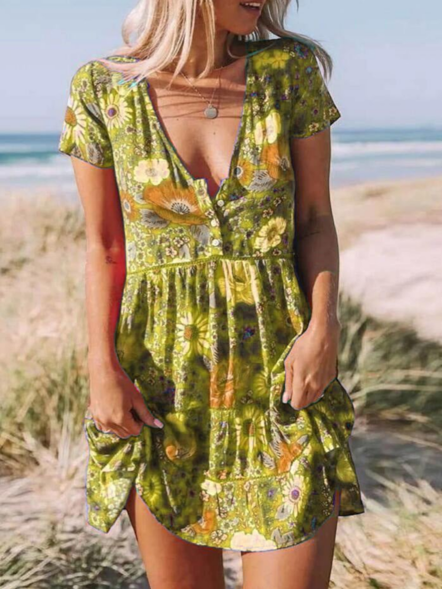 A short-sleeve mini dress with a boho design, featuring a relaxed fit and a flowing silhouette, suitable for summer wear. 0
