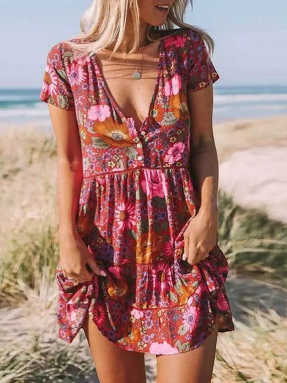 A short-sleeve mini dress with a boho design, featuring a relaxed fit and a flowing silhouette, suitable for summer wear. 1