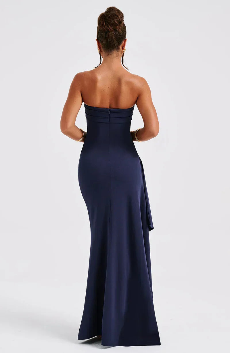 Maxi dress without straps featuring a high slit, designed for formal occasions such as weddings. 1