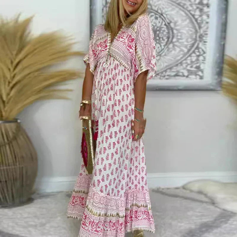Maxi dress with a V-neckline and Boho print, featuring a flowing design suitable for formal events. 0