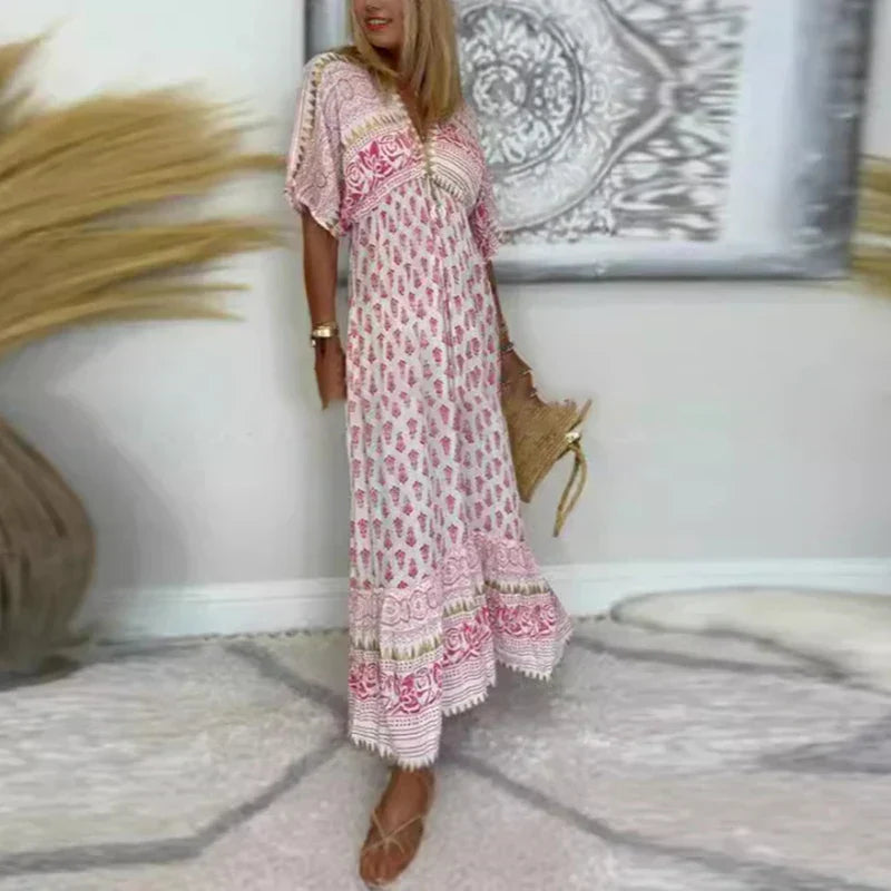 Maxi dress with a V-neckline and Boho print, featuring a flowing design suitable for formal events. 1