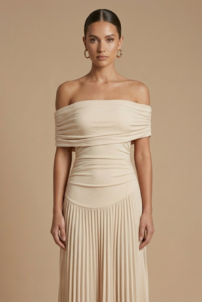 Maxi dress for women featuring off-the-shoulder sleeves and a pleated skirt, displayed on a mannequin. 2