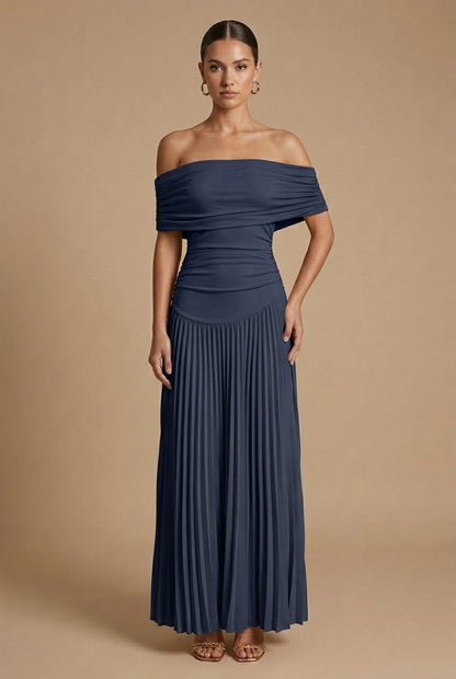 Maxi dress for women featuring off-the-shoulder sleeves and a pleated skirt, displayed on a mannequin. 4