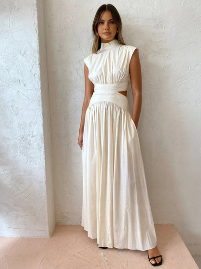 Maxi dress with a V-neckline and cut-out details, designed for formal events and summer gatherings. 0