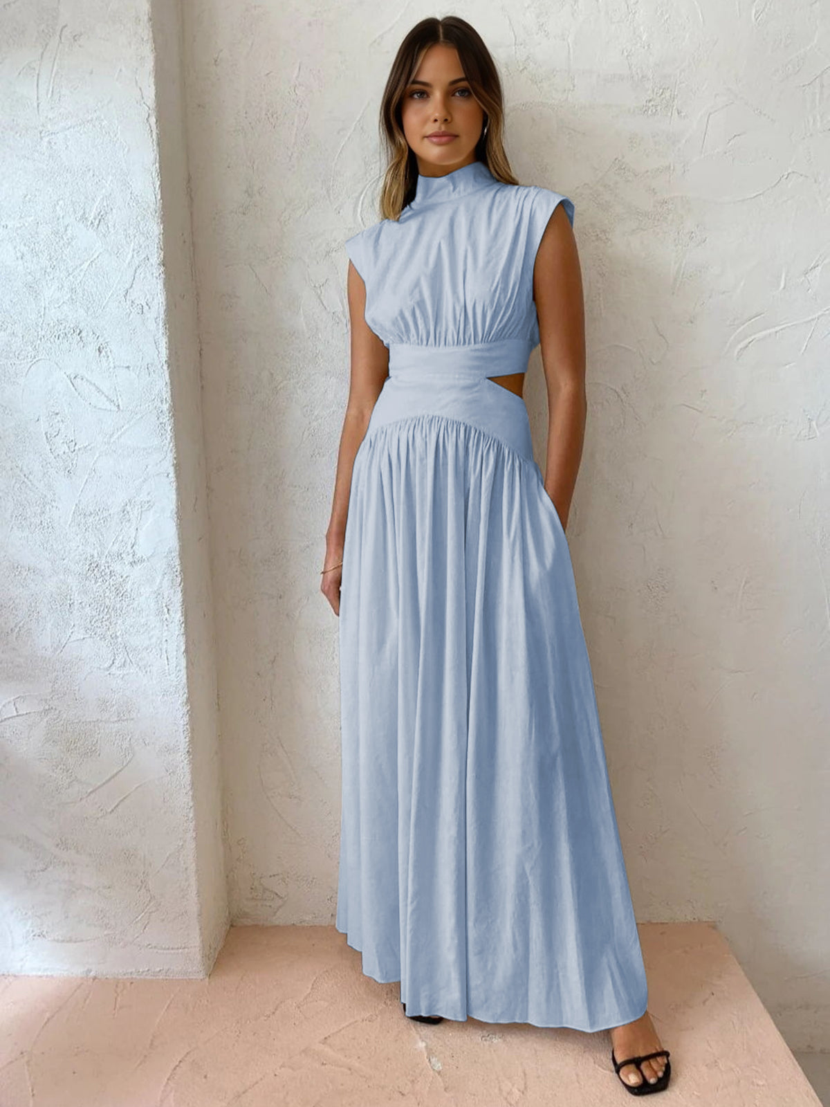 Maxi dress with a V-neckline and cut-out details, designed for formal events and summer gatherings. 6