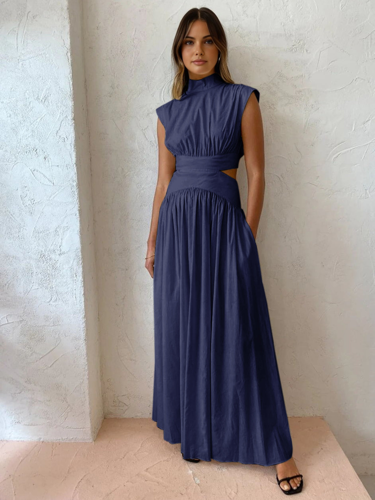Maxi dress with a V-neckline and cut-out details, designed for formal events and summer gatherings. 7