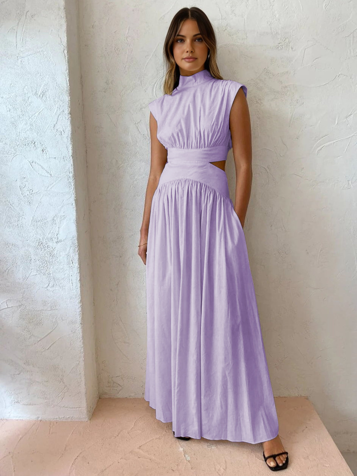 Maxi dress with a V-neckline and cut-out details, designed for formal events and summer gatherings. 8