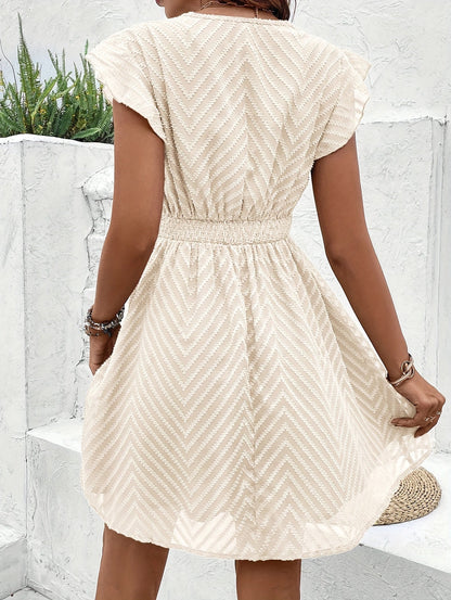 Mini A-line dress featuring a heart-shaped neckline, designed for formal events like weddings. 2