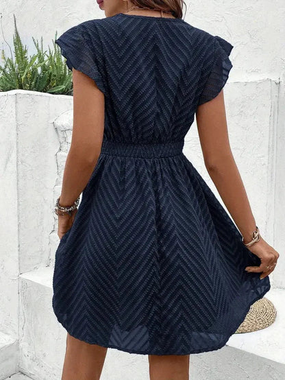 Mini A-line dress featuring a heart-shaped neckline, designed for formal events like weddings. 5