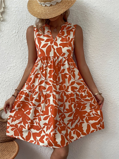 A women's dress featuring a V-neck design with a fashionable print, suitable for weddings and summer events. 0