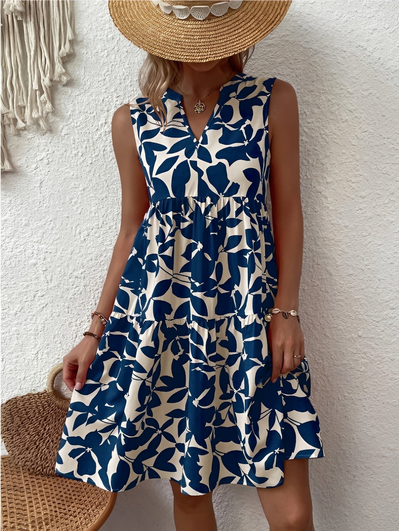 A women's dress featuring a V-neck design with a fashionable print, suitable for weddings and summer events. 1