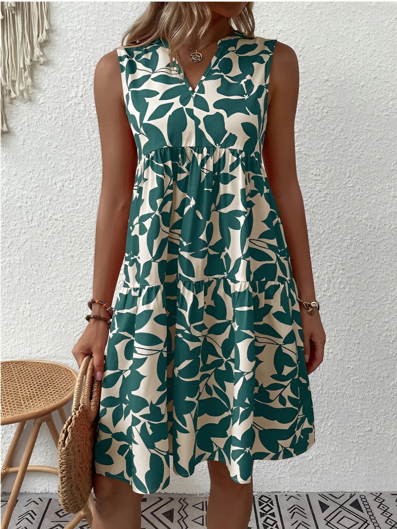 A women's dress featuring a V-neck design with a fashionable print, suitable for weddings and summer events. 3
