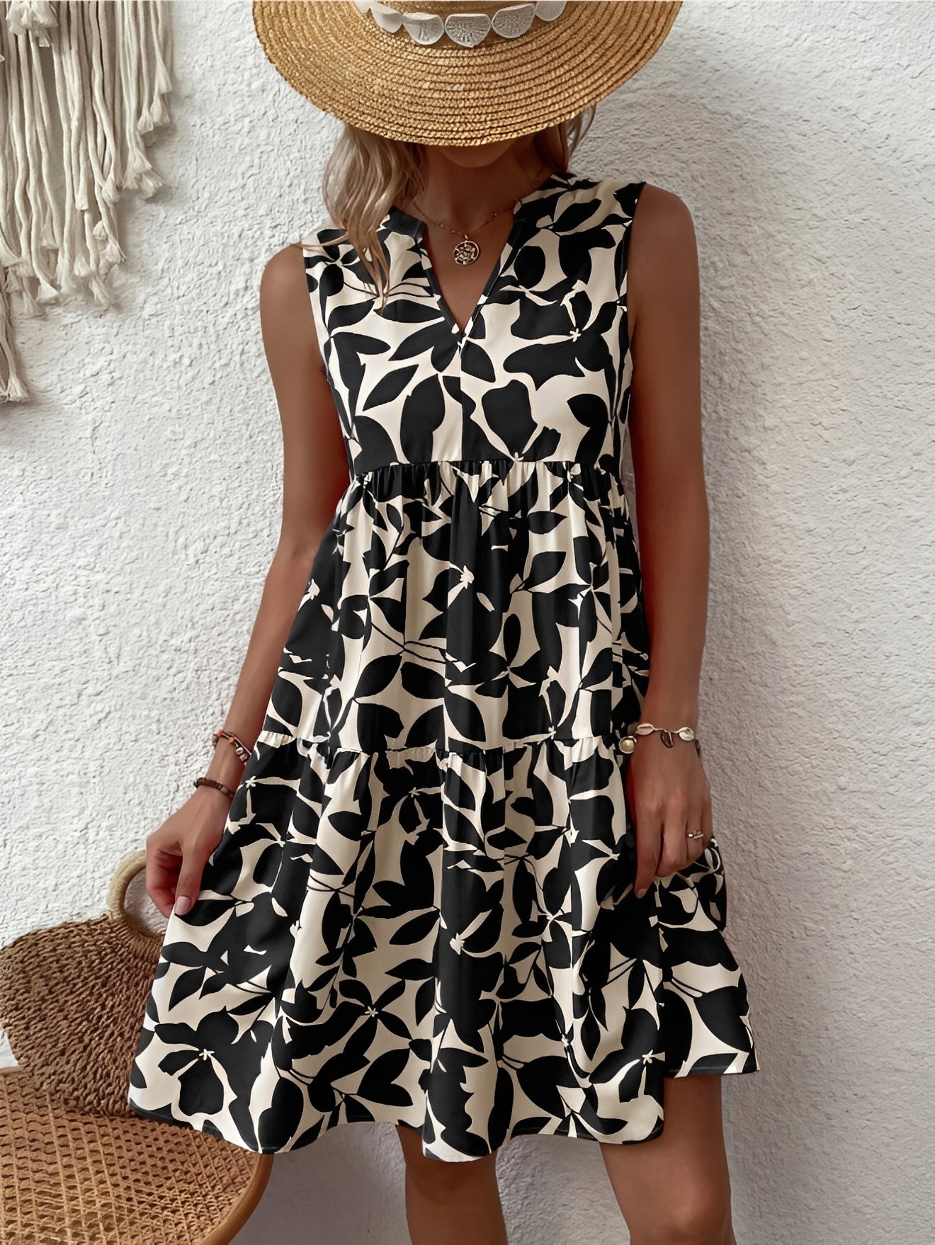 A women's dress featuring a V-neck design with a fashionable print, suitable for weddings and summer events. 4