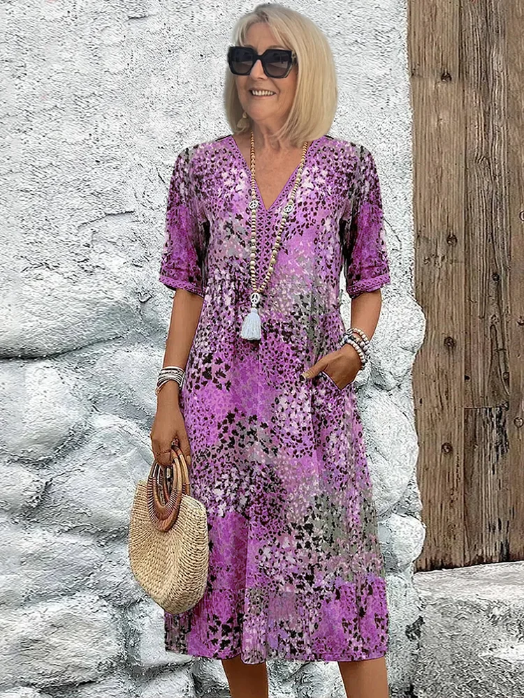 Woman's dress for weddings featuring a fitted design and vibrant pattern. 4