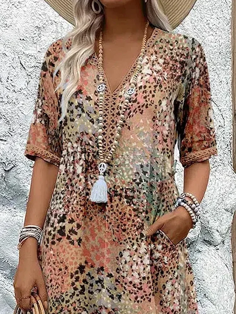 Woman's dress for weddings featuring a fitted design and vibrant pattern. 5