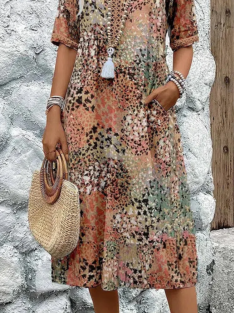 Woman's dress for weddings featuring a fitted design and vibrant pattern. 6