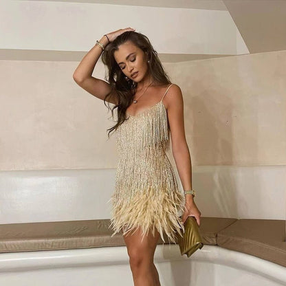 Cocktail midi dress featuring sequins and spaghetti straps, displayed on a mannequin against a neutral background. 4