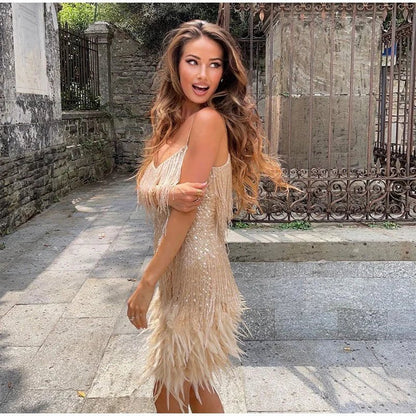 Cocktail midi dress featuring sequins and spaghetti straps, displayed on a mannequin against a neutral background. 5