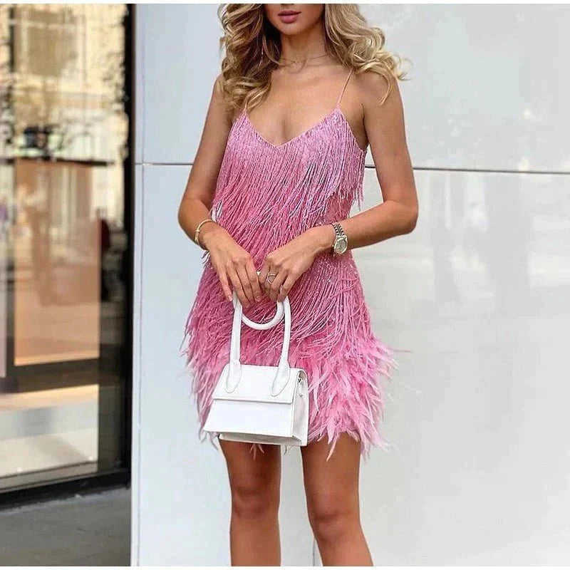 Cocktail midi dress featuring sequins and spaghetti straps, displayed on a mannequin against a neutral background. 6