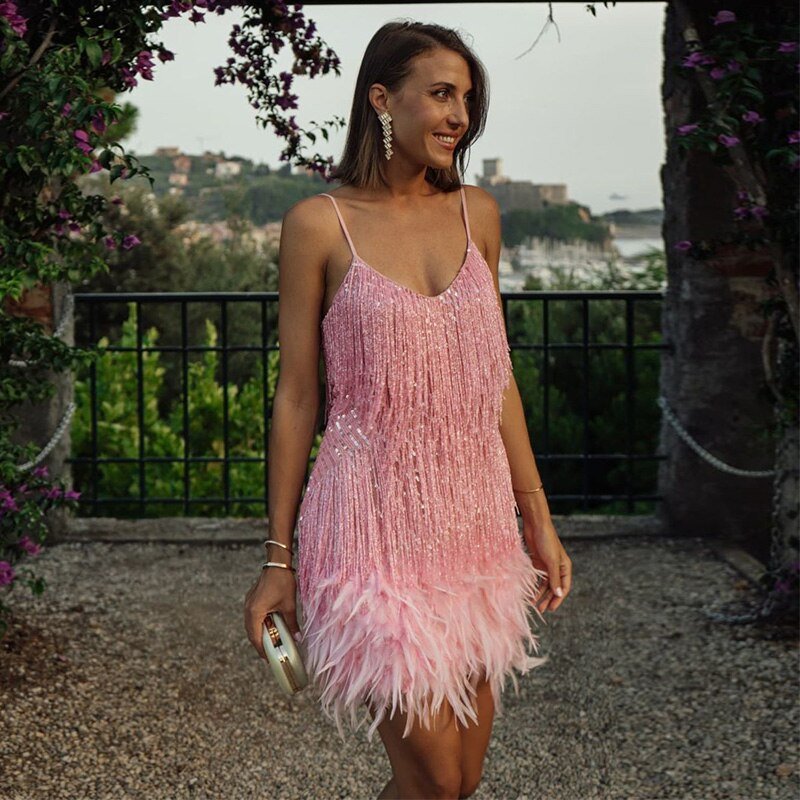Cocktail midi dress featuring sequins and spaghetti straps, displayed on a mannequin against a neutral background. 7