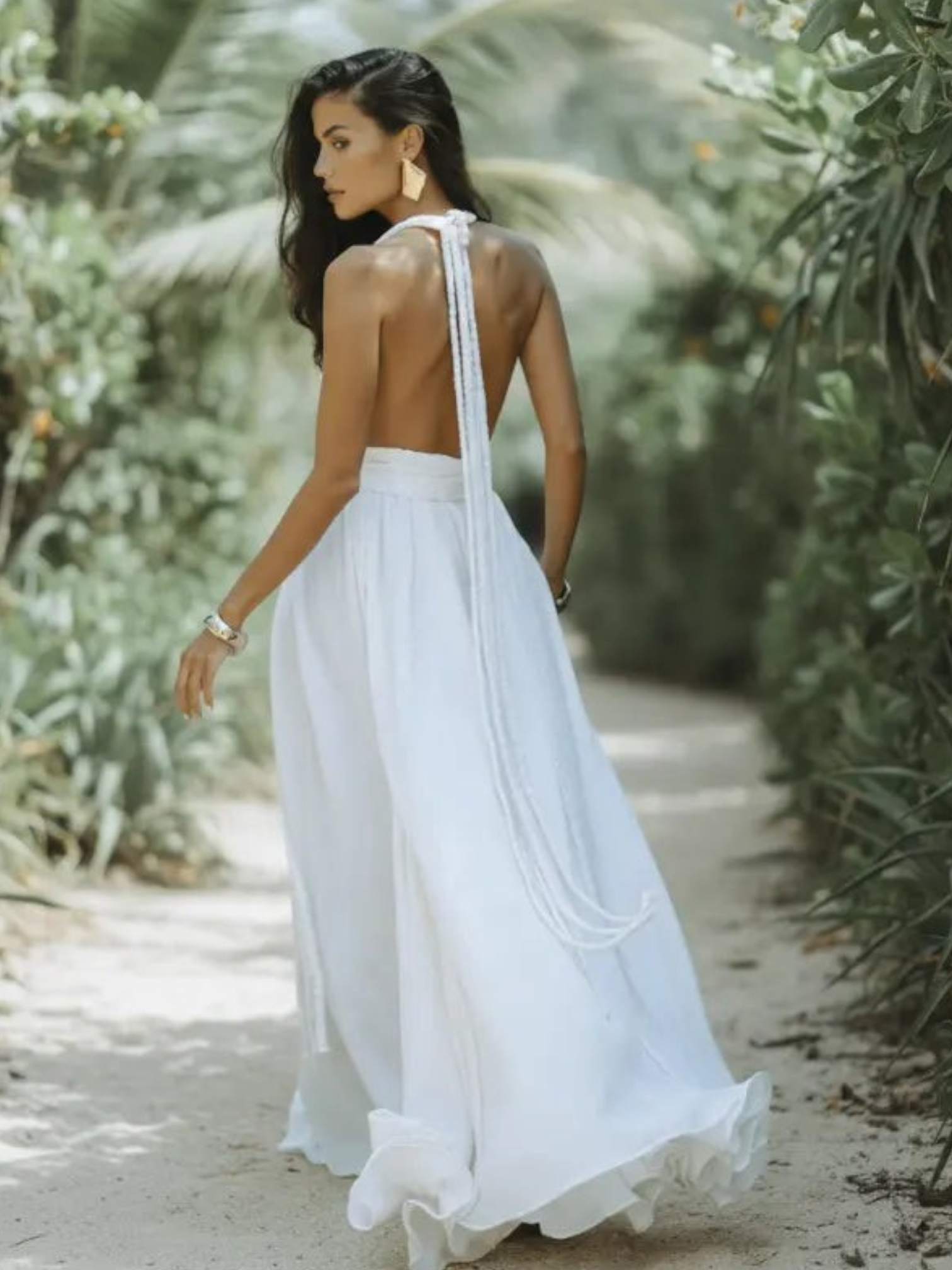 Maxi dress with a backless design and neck tie, suitable for weddings. 1
