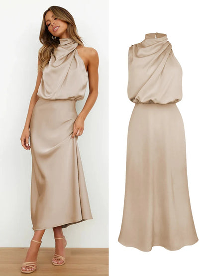 Elegant midi dress for women featuring an asymmetrical neckline. The dress has a fitted bodice and a flowing skirt that falls below the knee. 10