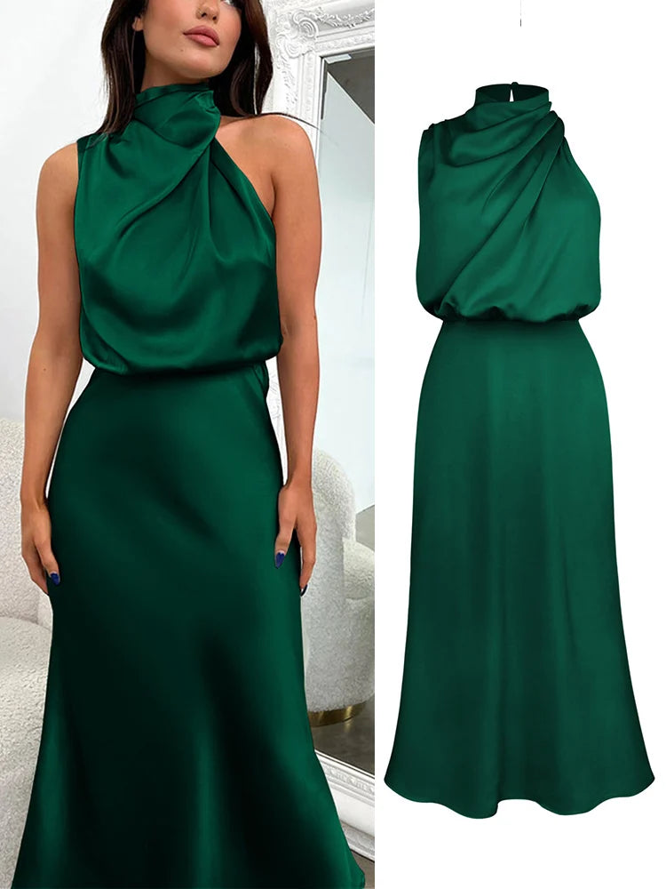 Elegant midi dress for women featuring an asymmetrical neckline. The dress has a fitted bodice and a flowing skirt that falls below the knee. 12