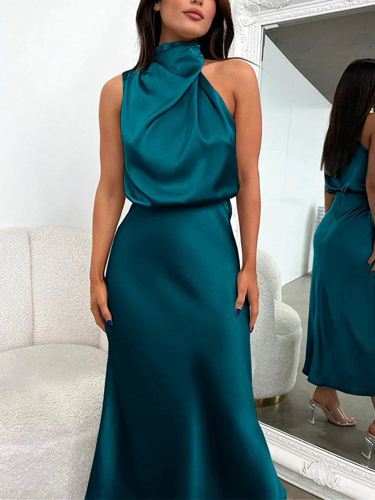 Elegant midi dress for women featuring an asymmetrical neckline. The dress has a fitted bodice and a flowing skirt that falls below the knee. 1