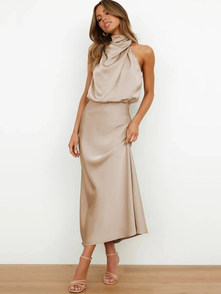 Elegant midi dress for women featuring an asymmetrical neckline. The dress has a fitted bodice and a flowing skirt that falls below the knee. 4