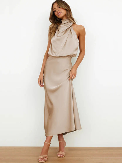 Elegant midi dress for women featuring an asymmetrical neckline. The dress has a fitted bodice and a flowing skirt that falls below the knee. 4