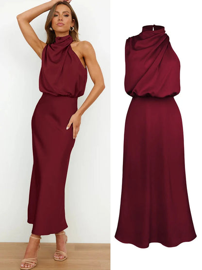 Elegant midi dress for women featuring an asymmetrical neckline. The dress has a fitted bodice and a flowing skirt that falls below the knee. 7