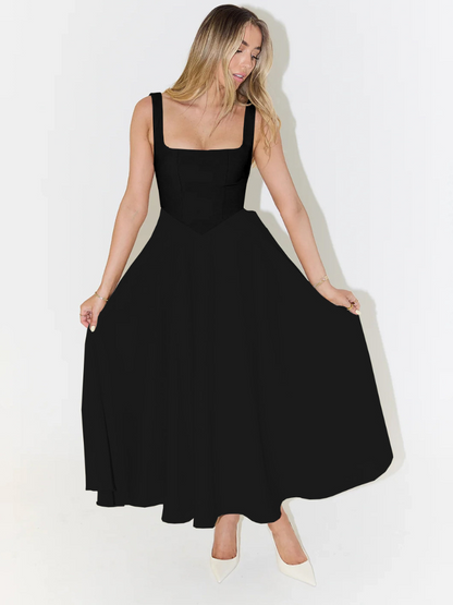 Midi dress featuring a square neckline and wide straps, designed for elegant occasions. The dress has a fitted bodice and a flowing skirt that falls to mid 5