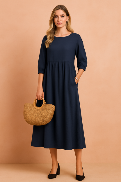 Midi dress with 3/4 sleeves and a defined waist, featuring a fitted bodice and flowing skirt. 1