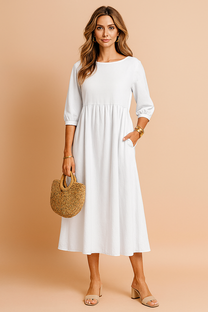 Midi dress with 3/4 sleeves and a defined waist, featuring a fitted bodice and flowing skirt. 9