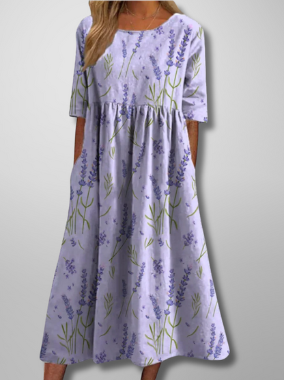 Midi dress featuring a floral pattern and delicate draping, designed for formal occasions like weddings. 2
