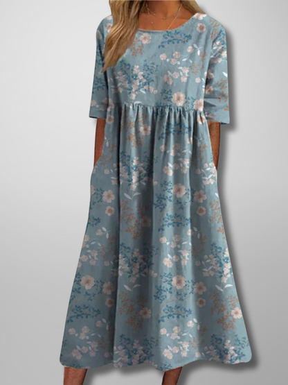 Midi dress featuring a floral pattern and delicate draping, designed for formal occasions like weddings. 4