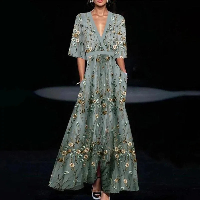 Midi evening dress with a floral pattern and a loose fit, displayed on a mannequin against a neutral backdrop. 0
