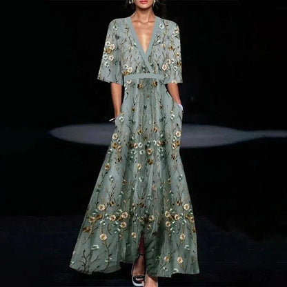 Midi evening dress with a floral pattern and a loose fit, displayed on a mannequin against a neutral backdrop. 0