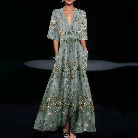Midi evening dress with a floral pattern and a loose fit, displayed on a mannequin against a neutral backdrop. 0