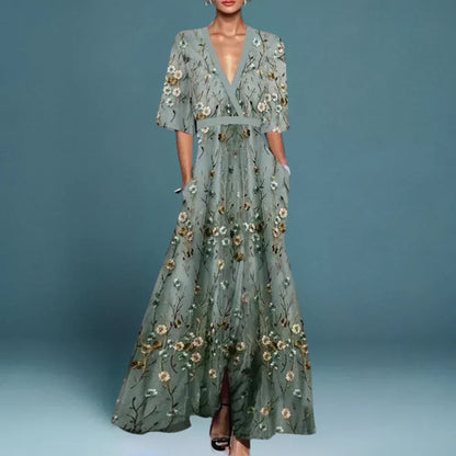 Midi evening dress with a floral pattern and a loose fit, displayed on a mannequin against a neutral backdrop. 1