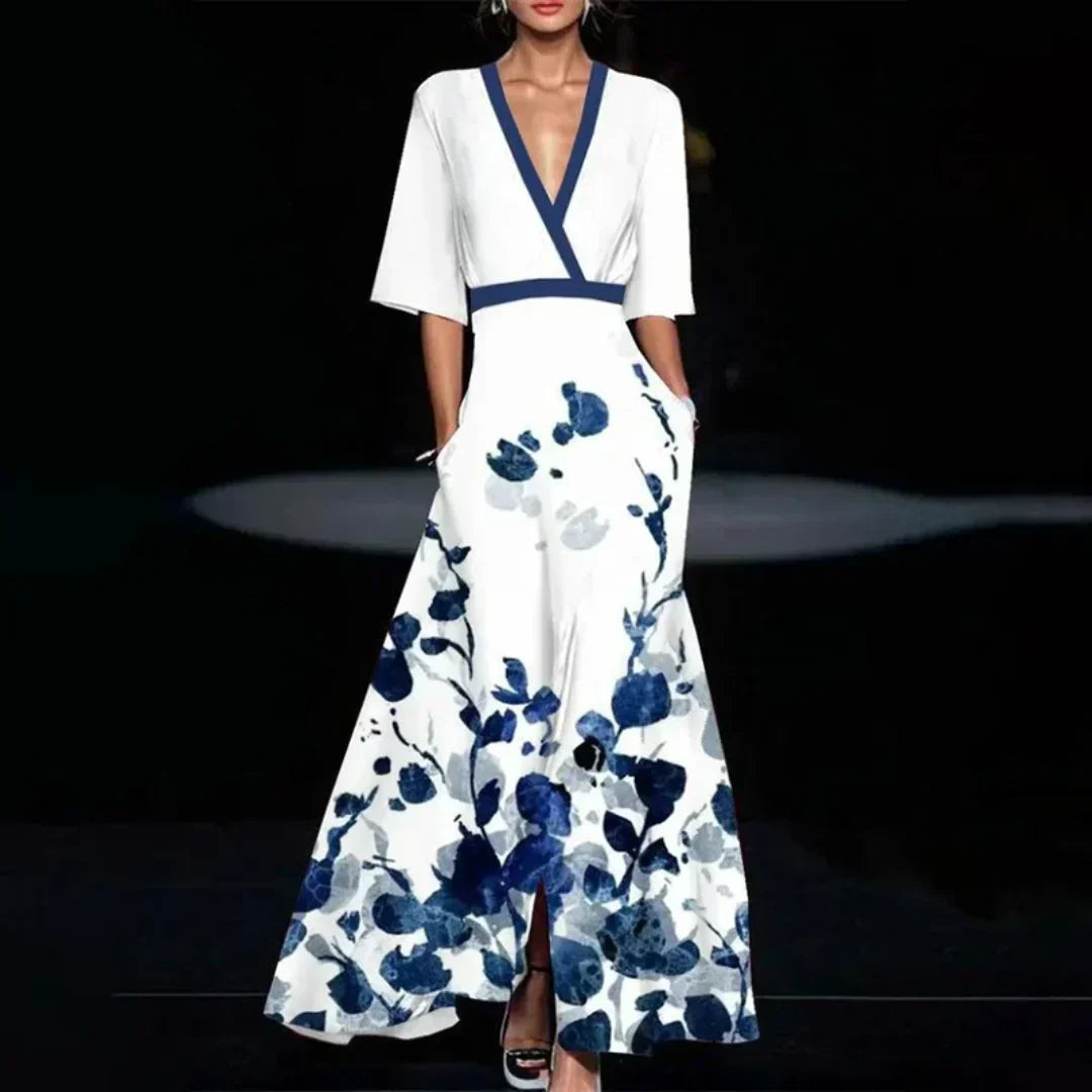 Midi evening dress with a floral pattern and a loose fit, displayed on a mannequin against a neutral backdrop. 2