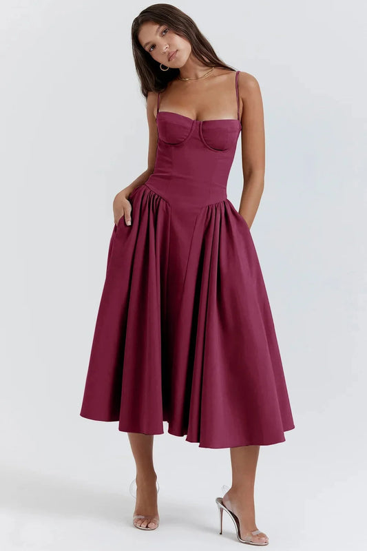 Midi evening dress featuring lace details and adjustable straps. The dress has a fitted bodice and a flowing skirt, showcasing elegant design elements. 0