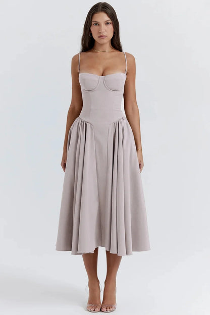 Midi evening dress featuring lace details and adjustable straps. The dress has a fitted bodice and a flowing skirt, showcasing elegant design elements. 2