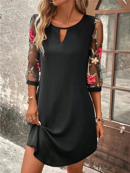 A lightweight summer dress designed for women, featuring a flowing silhouette and an elegant neckline, displayed on a mannequin against a neutral background. 0