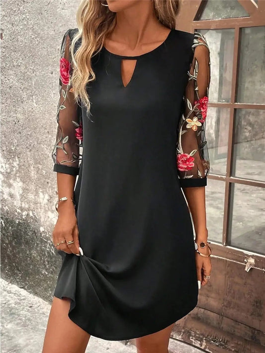 A lightweight summer dress designed for women, featuring a flowing silhouette and an elegant neckline, displayed on a mannequin against a neutral background. 0