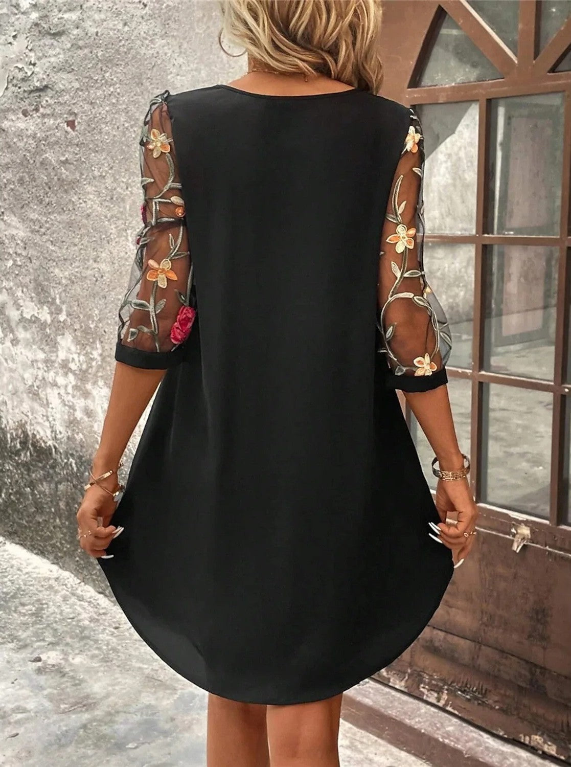 A lightweight summer dress designed for women, featuring a flowing silhouette and an elegant neckline, displayed on a mannequin against a neutral background. 1