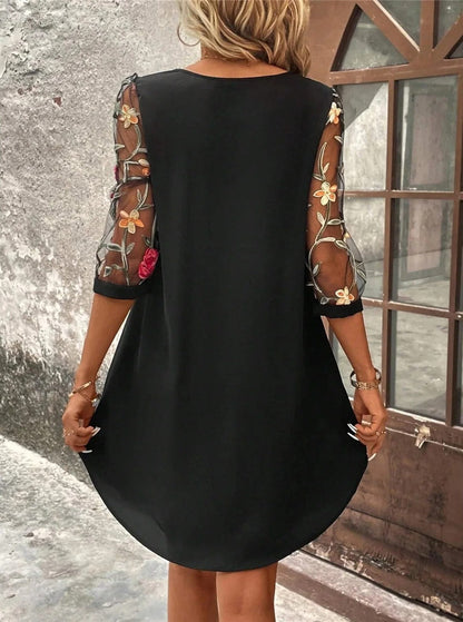 A lightweight summer dress designed for women, featuring a flowing silhouette and an elegant neckline, displayed on a mannequin against a neutral background. 1