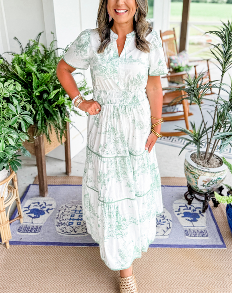 A women's maxi dress featuring a V-neckline and an A-line silhouette, displayed on a mannequin. The dress falls to the ankles, showcasing a flowing 6