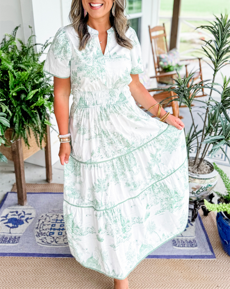 A women's maxi dress featuring a V-neckline and an A-line silhouette, displayed on a mannequin. The dress falls to the ankles, showcasing a flowing 8